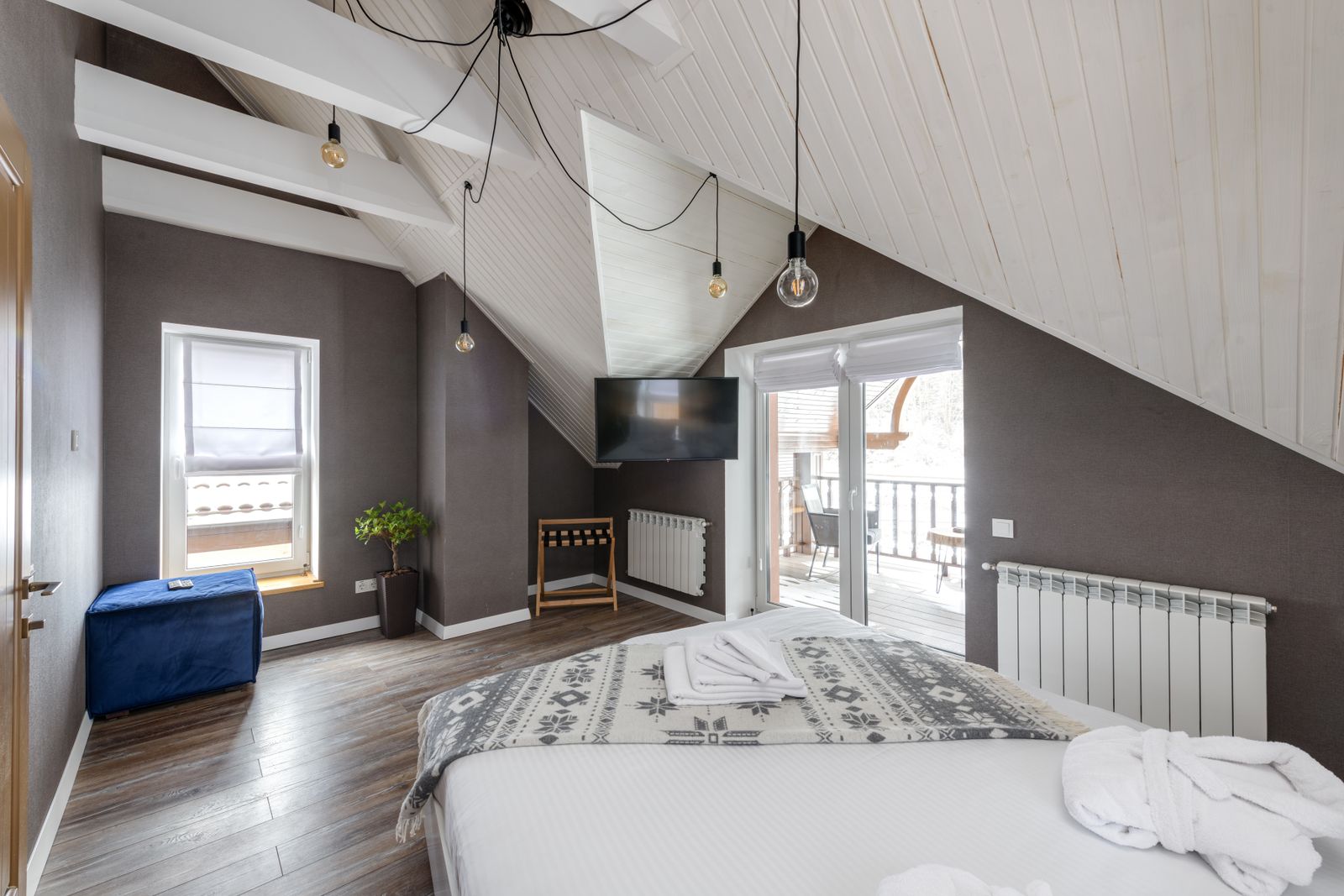 A warm, comfortable guest room at Hotel Engelhard in Engelhard, North Carolina